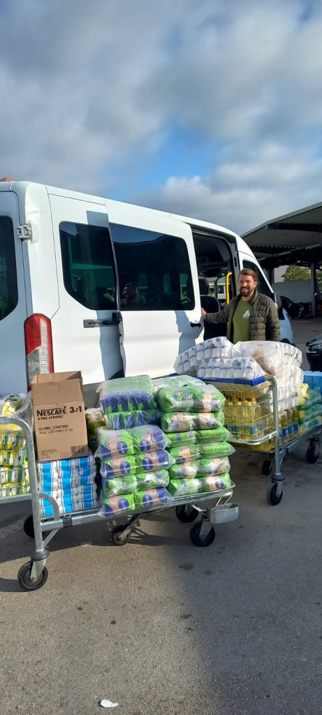 Peace Corps volunteer after shopping for the food for the elderly.