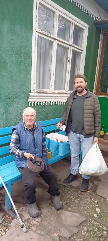 A Peace Corps volunteer and a beneficiary of the food package.