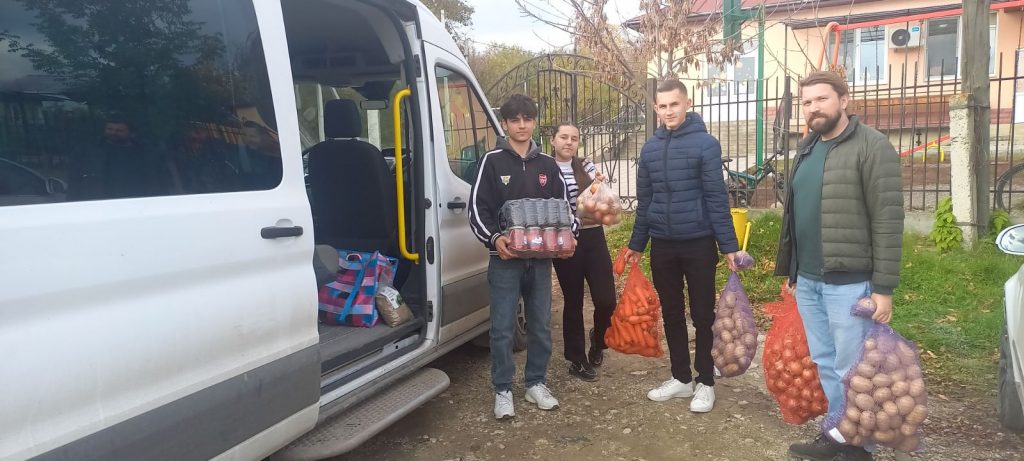 Volunteers unloading food for the van after grocery shopping