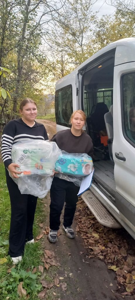 Volunteers delivering diapers