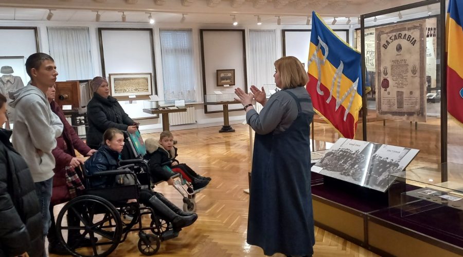 Children with disabilities and their parents enjoying the museum.