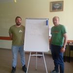 Victor and Adam standing in front of the whiteboard. "Mulțumesc Adam!!! Thank you!!!" is written on it.