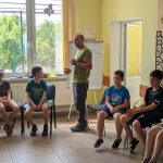 Mr. Victor telling bible stories to the children.