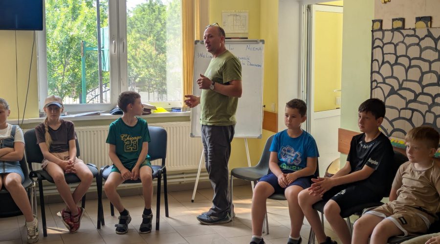 Mr. Victor telling bible stories to the children.