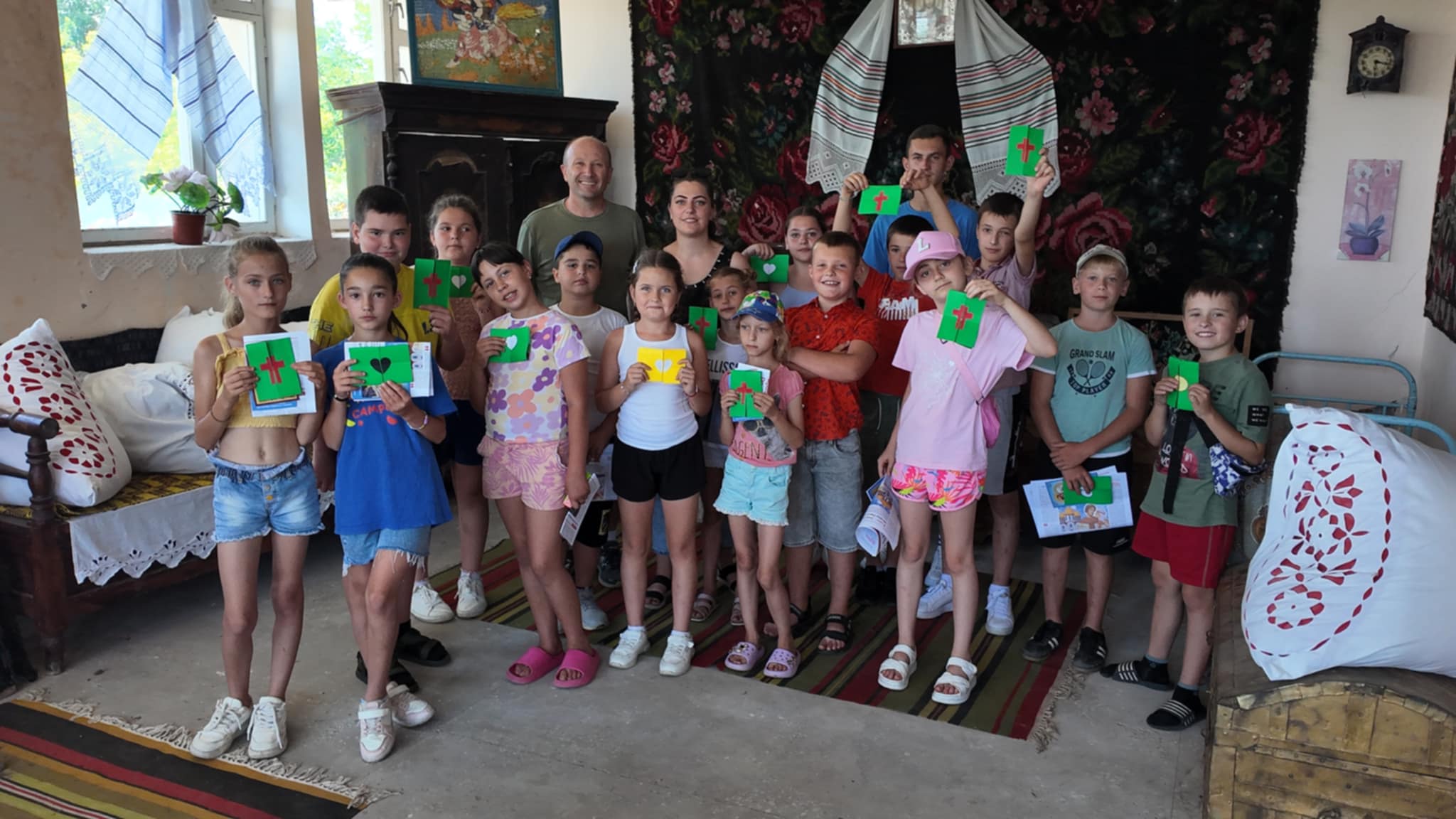 Kids posing with their crafts with Victor.