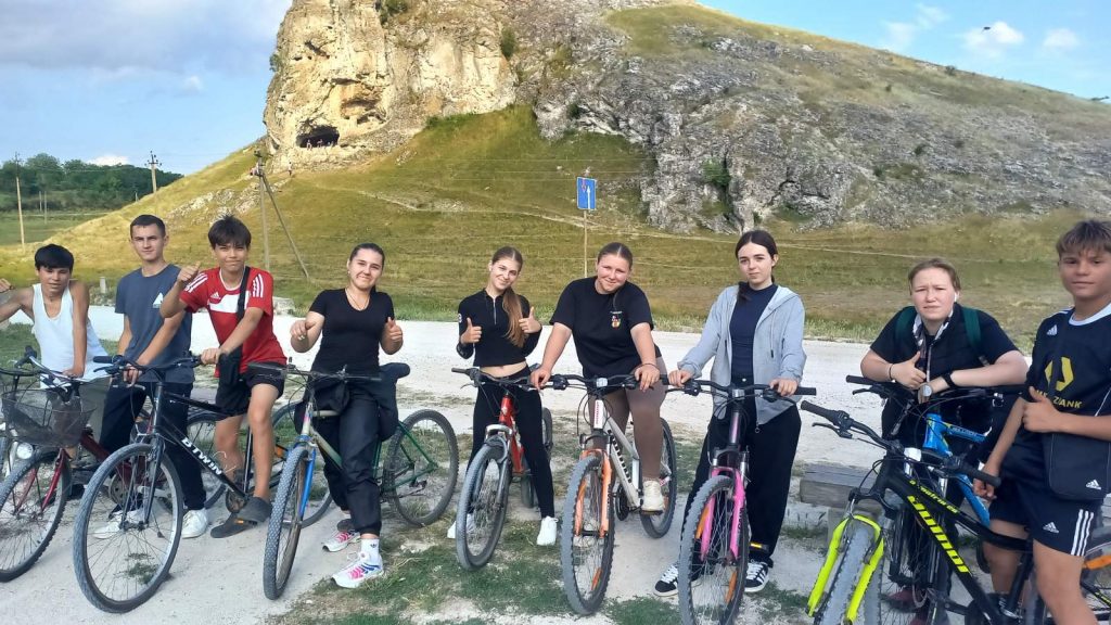 Nine volunteers on their bikes.